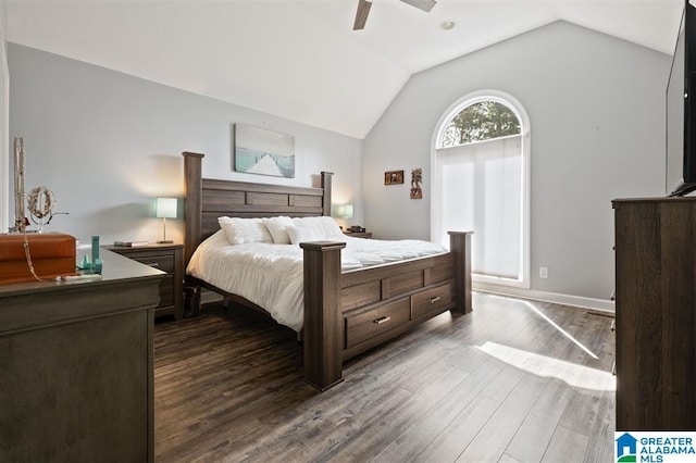 bedroom with ceiling fan, lofted ceiling, and dark wood-type flooring