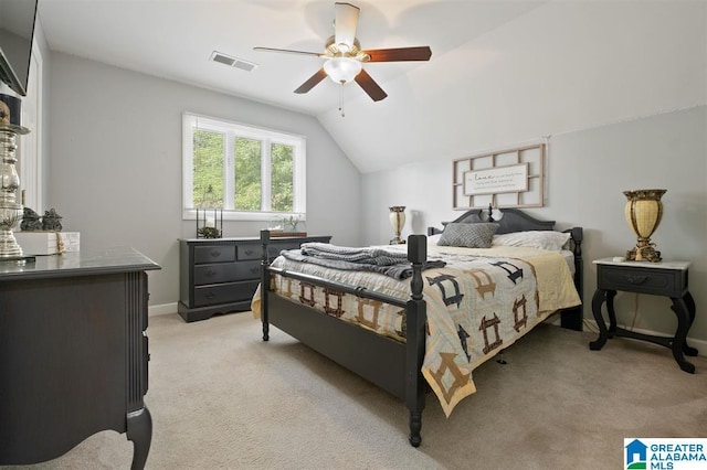 bedroom featuring ceiling fan, light carpet, and lofted ceiling