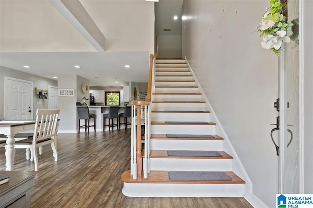 stairway featuring hardwood / wood-style floors