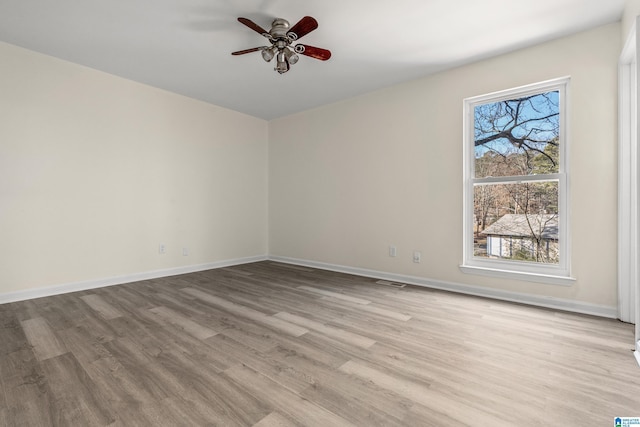 unfurnished room featuring light hardwood / wood-style flooring and ceiling fan