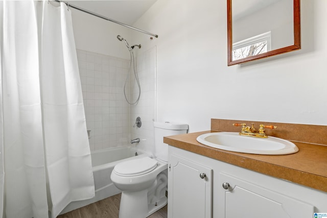 full bathroom featuring shower / tub combo with curtain, vanity, wood-type flooring, and toilet