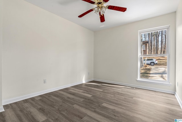 spare room featuring ceiling fan and wood-type flooring