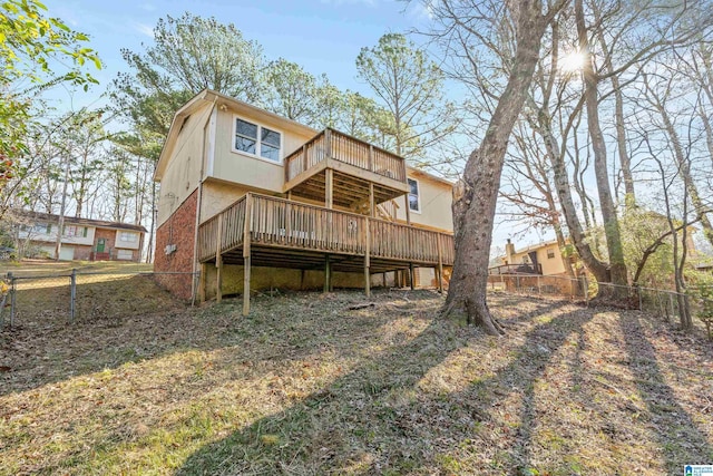 back of property featuring a wooden deck