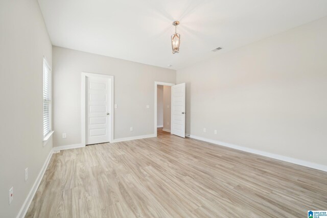 unfurnished bedroom with light hardwood / wood-style flooring