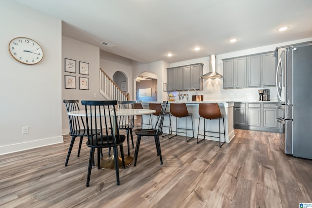 dining room with dark hardwood / wood-style floors and sink