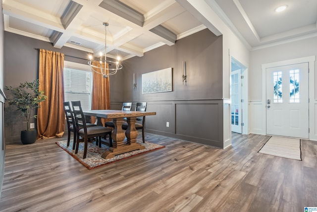 dining space featuring a wealth of natural light, hardwood / wood-style flooring, and ornamental molding