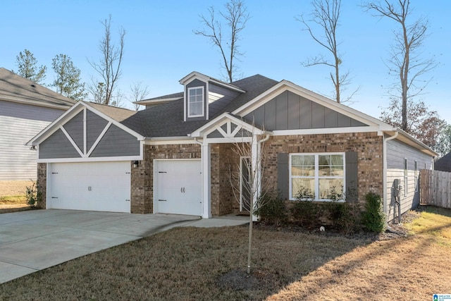 view of front of property with a garage and a front lawn