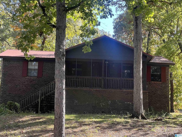 view of front of property with a sunroom