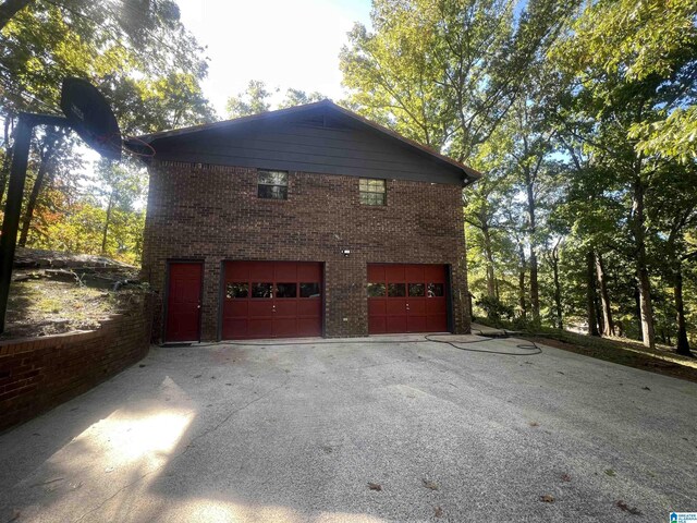 view of side of home with a garage