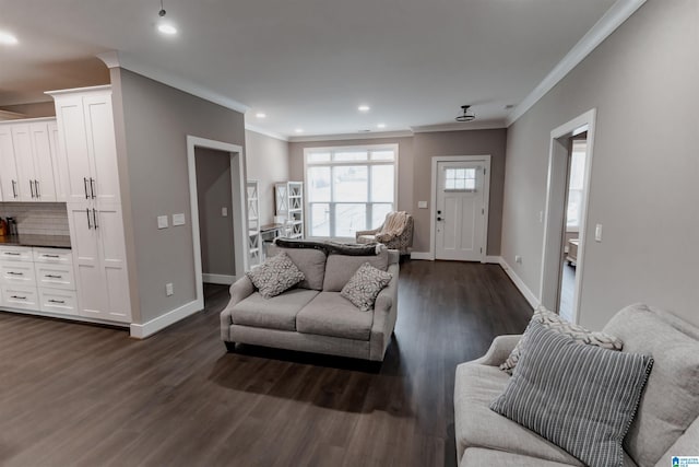 living room with crown molding and dark hardwood / wood-style flooring