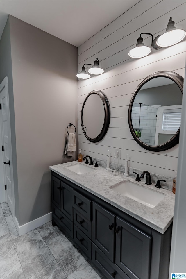 bathroom with vanity and wooden walls