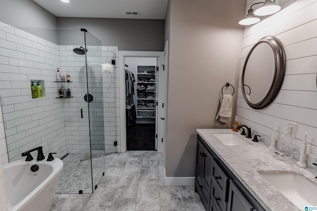 bathroom featuring vanity and shower with separate bathtub