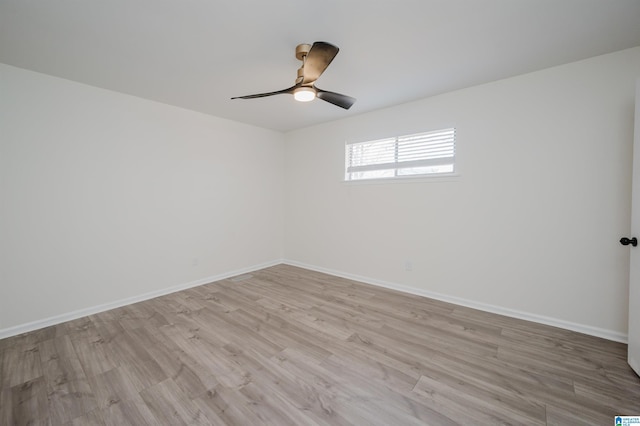 unfurnished room with light hardwood / wood-style floors