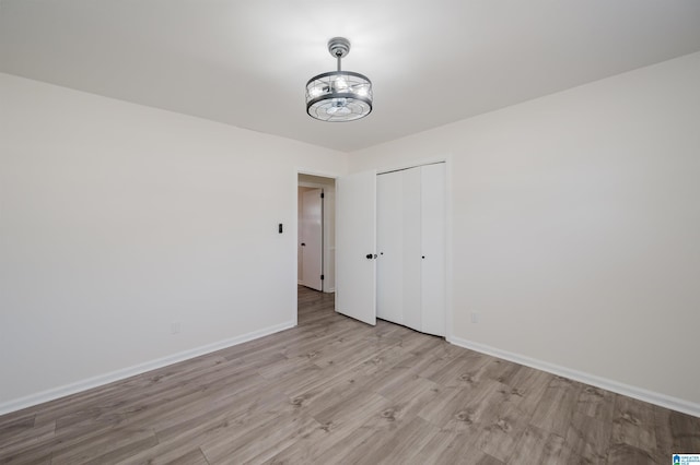 spare room with light wood-type flooring