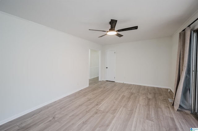 spare room featuring light hardwood / wood-style floors and ceiling fan