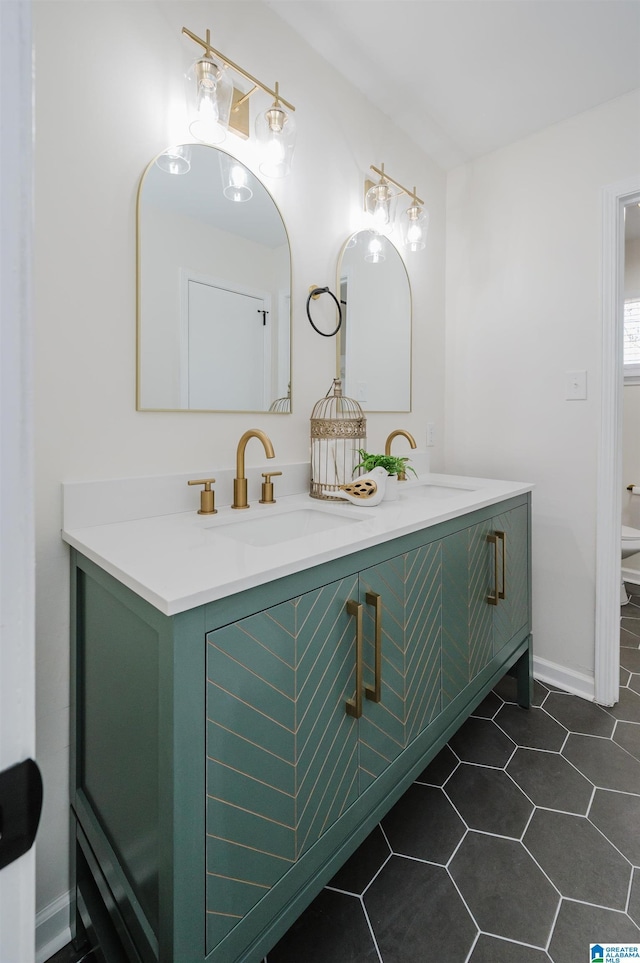 bathroom featuring toilet and vanity