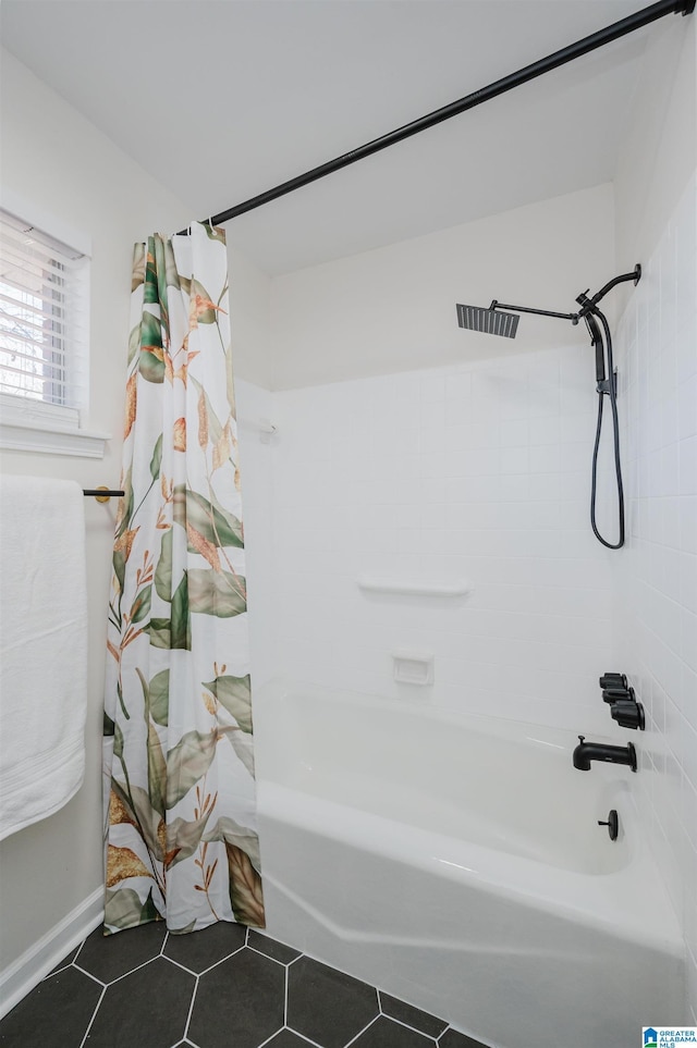 bathroom featuring shower / bath combo with shower curtain and tile patterned flooring