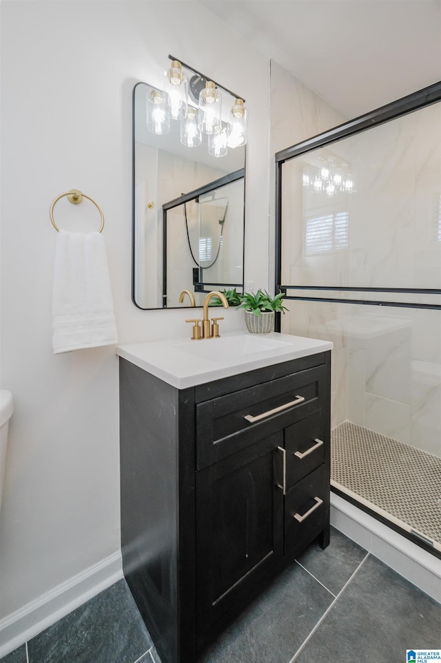 bathroom with vanity, tile patterned floors, and walk in shower