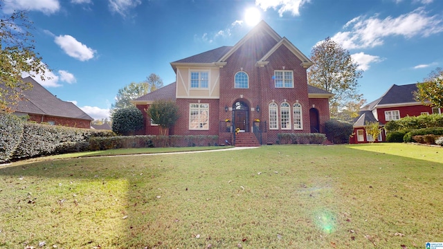 view of property featuring a front lawn