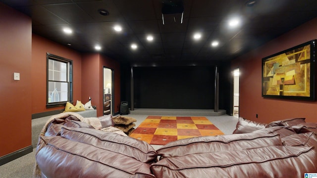 cinema room featuring light colored carpet