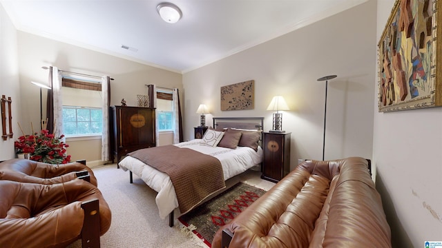 bedroom with carpet flooring and ornamental molding