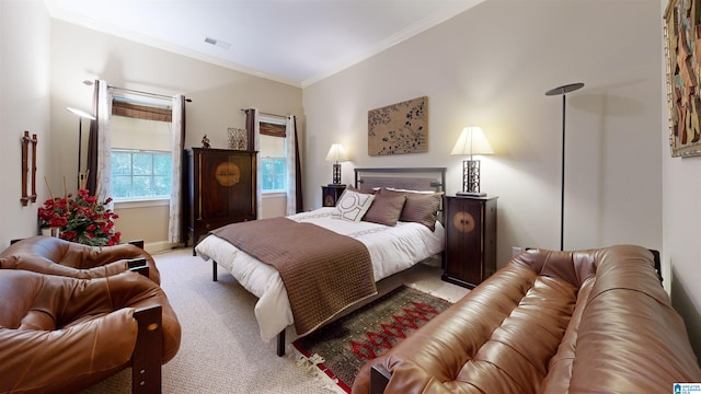 carpeted bedroom featuring crown molding