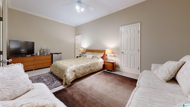 bedroom with dark carpet, ceiling fan, and crown molding