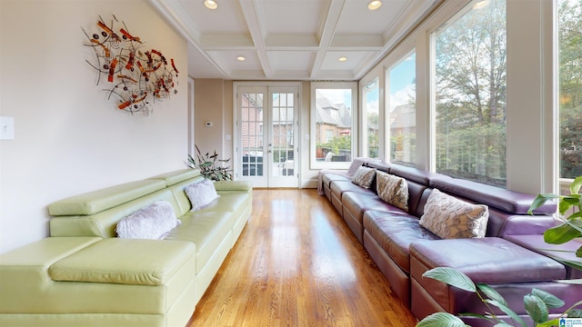 sunroom / solarium featuring beamed ceiling, french doors, and coffered ceiling