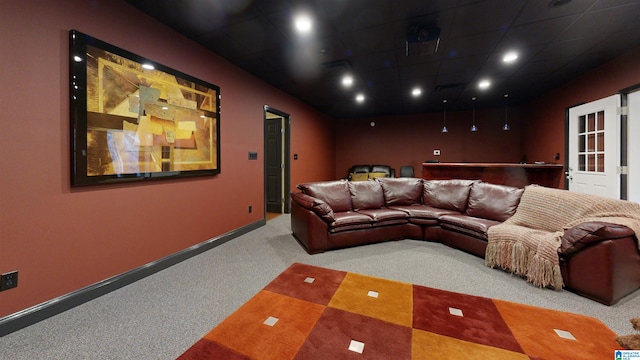 cinema room featuring carpet flooring