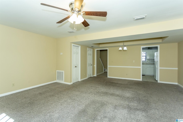 spare room with light carpet and ceiling fan