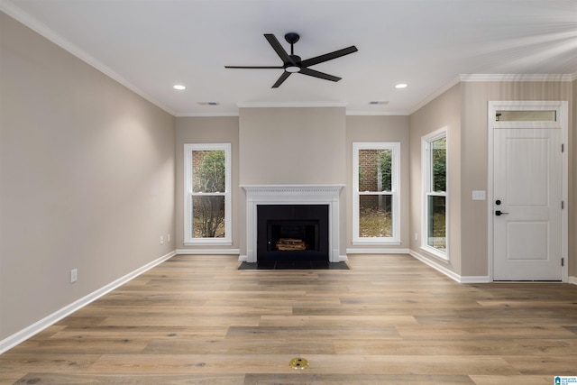 unfurnished living room featuring light wood-type flooring, ceiling fan, and crown molding