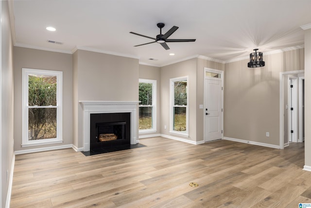 unfurnished living room featuring ceiling fan, light hardwood / wood-style floors, and a wealth of natural light