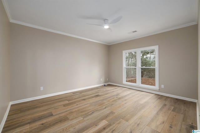 spare room featuring light hardwood / wood-style floors, ceiling fan, and crown molding