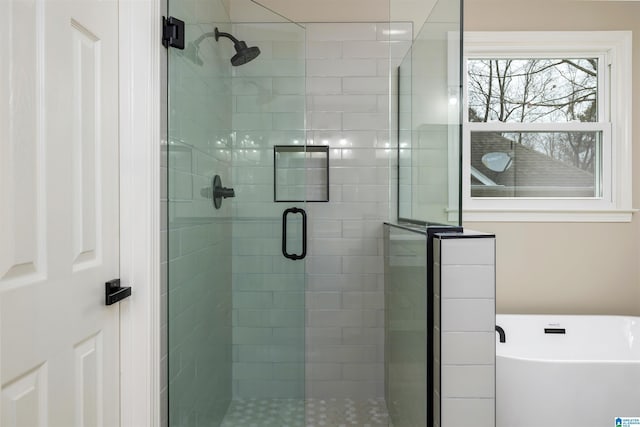 bathroom featuring plus walk in shower