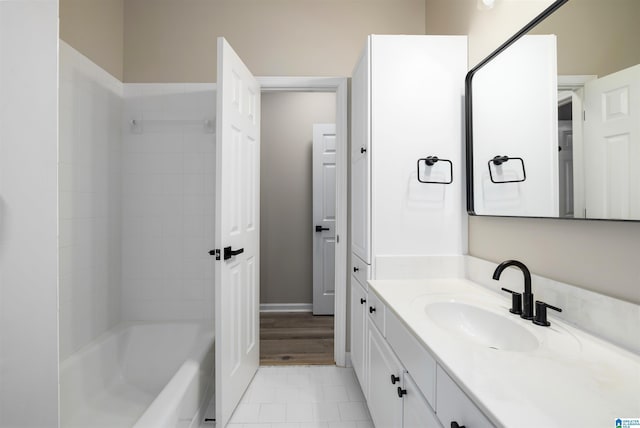 bathroom with vanity and shower / washtub combination