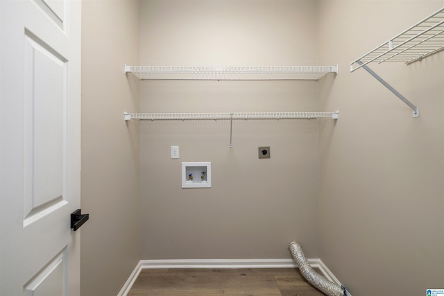 laundry area with hookup for an electric dryer, hardwood / wood-style floors, and washer hookup