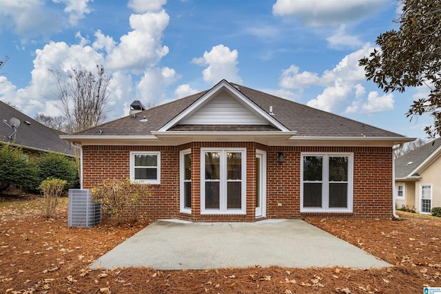 rear view of property featuring cooling unit and a patio