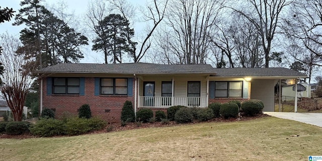 ranch-style home featuring a porch and a front yard