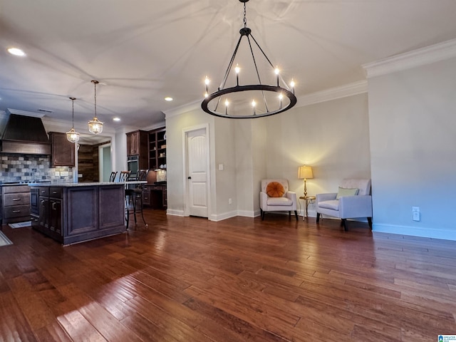 interior space featuring crown molding, dark wood-type flooring, and an inviting chandelier