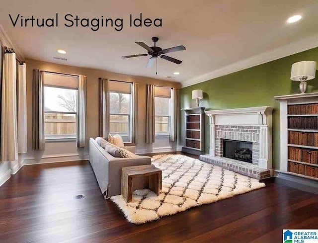 living room featuring dark hardwood / wood-style floors, ceiling fan, crown molding, and a fireplace