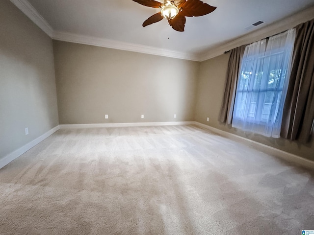 carpeted empty room with ceiling fan and ornamental molding