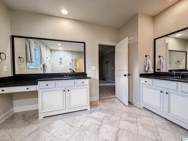 bathroom with tile patterned flooring and vanity