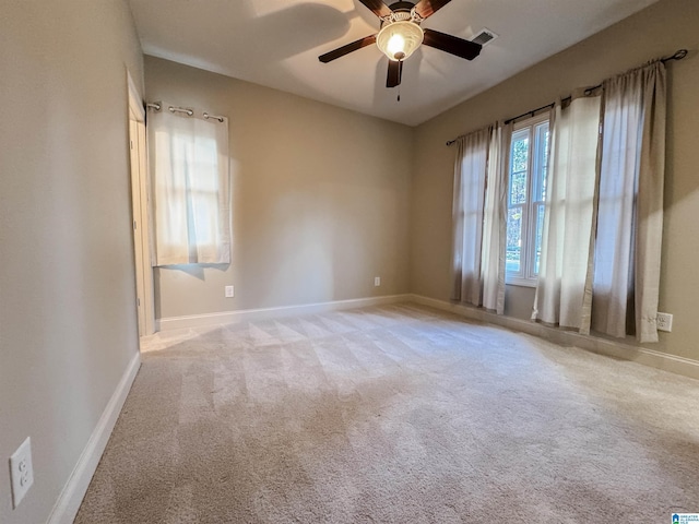 carpeted empty room with ceiling fan