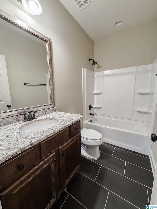 full bathroom featuring tile patterned flooring, vanity, toilet, and shower / bath combination