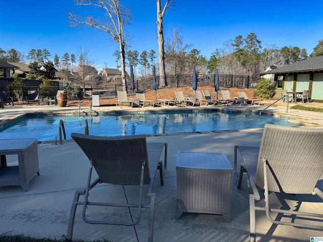 view of swimming pool with a patio area