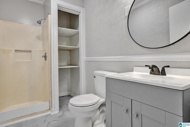 bathroom with vanity, toilet, and walk in shower