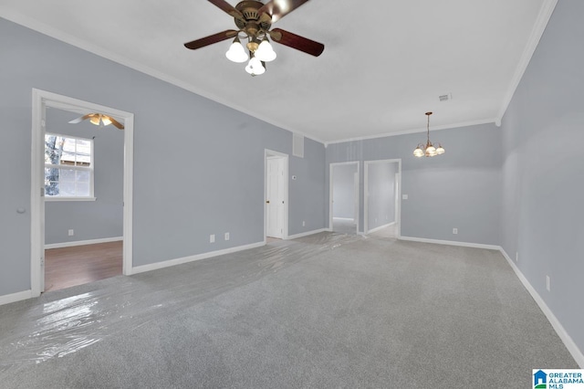 unfurnished living room featuring ceiling fan with notable chandelier, carpet floors, and ornamental molding