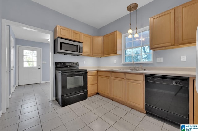 kitchen with hanging light fixtures, light brown cabinetry, sink, and black appliances