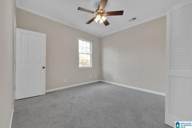 unfurnished bedroom with carpet, ceiling fan, and ornamental molding