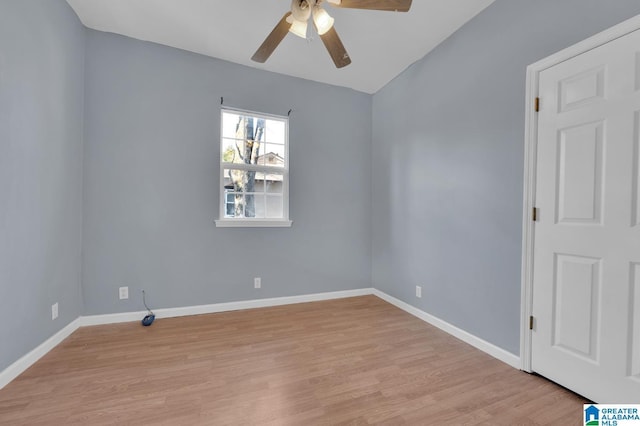 empty room featuring ceiling fan and light hardwood / wood-style flooring